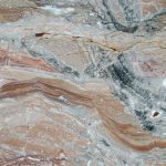 Italian marble that stands out for its warm colors with veins and bold designs. Its geometric texture is perfect for open book use.